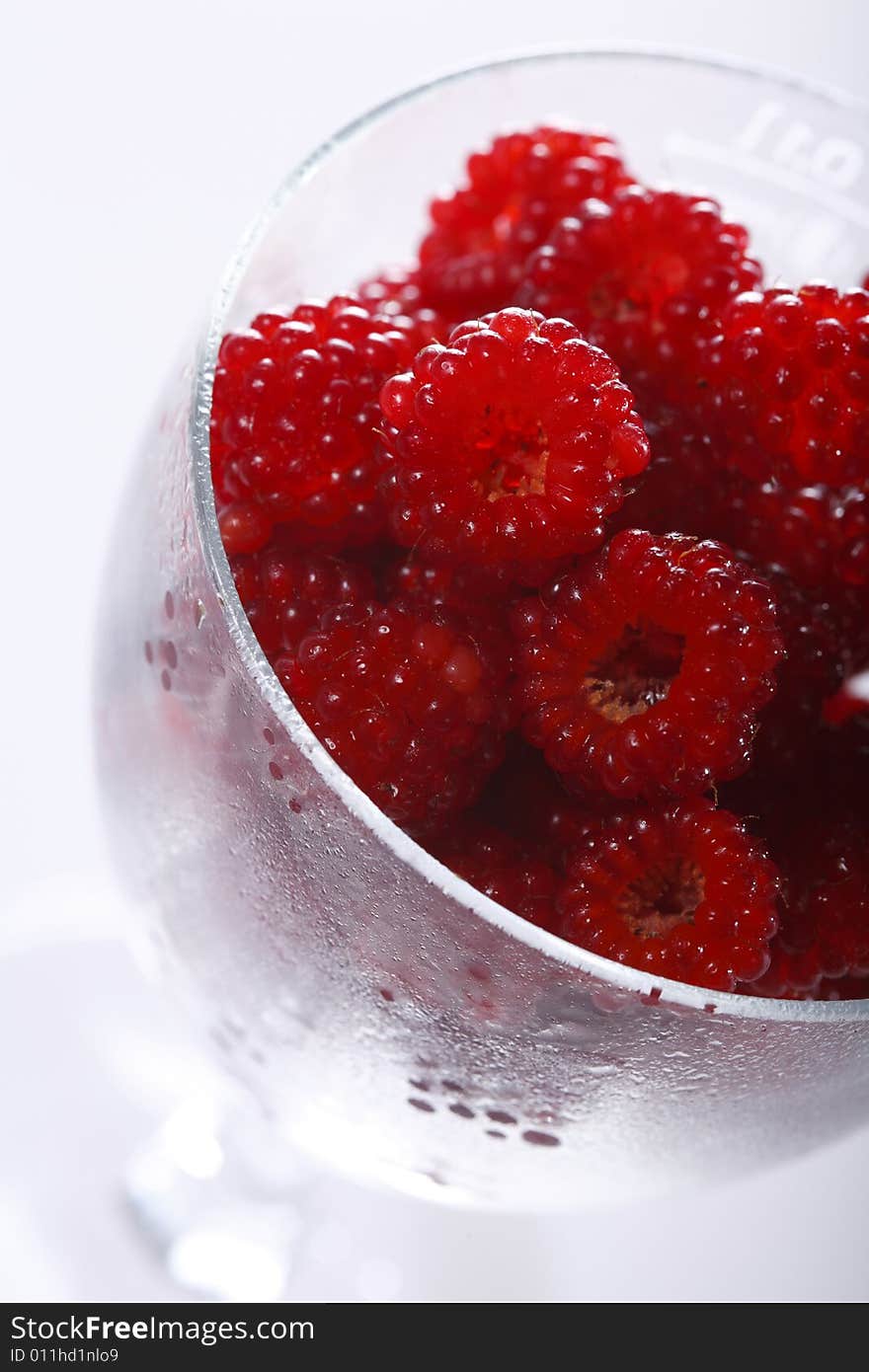 Raspberries In A Glass