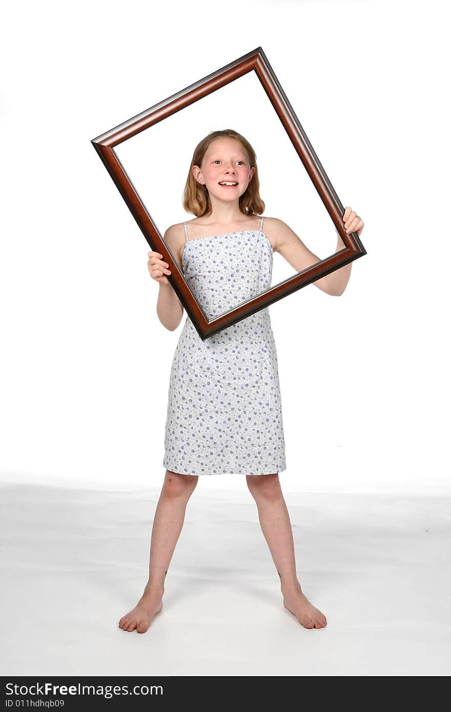 Girl holding frame around her upper body