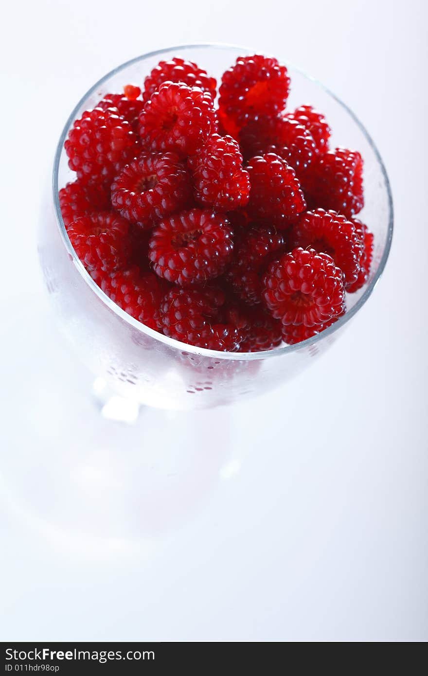 Raspberries In A Glass