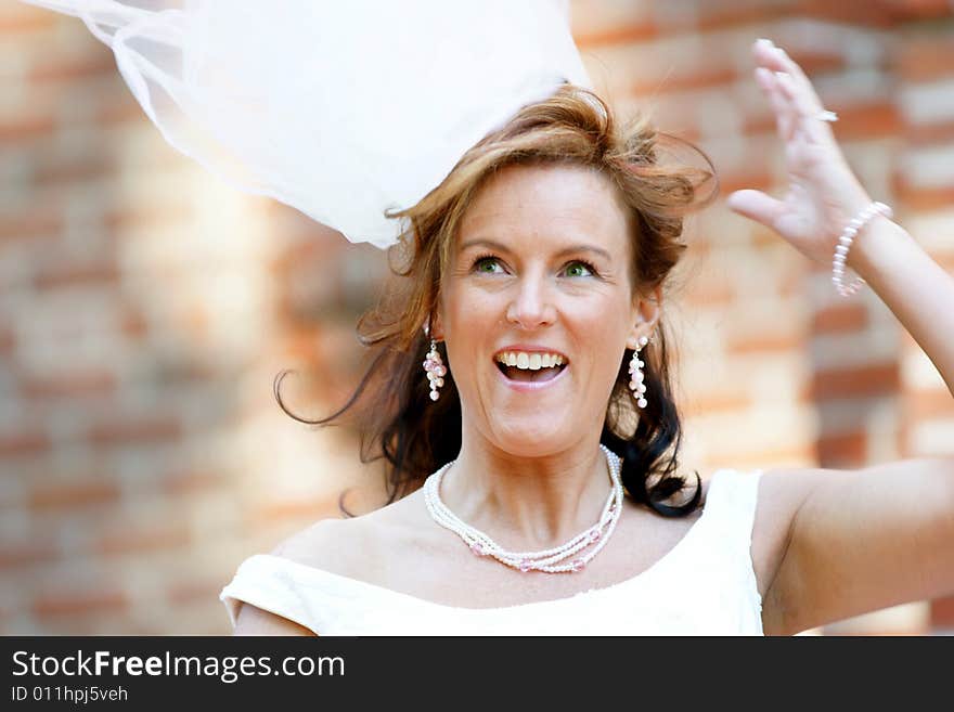 Lovely Bride with veil blowing in the wind