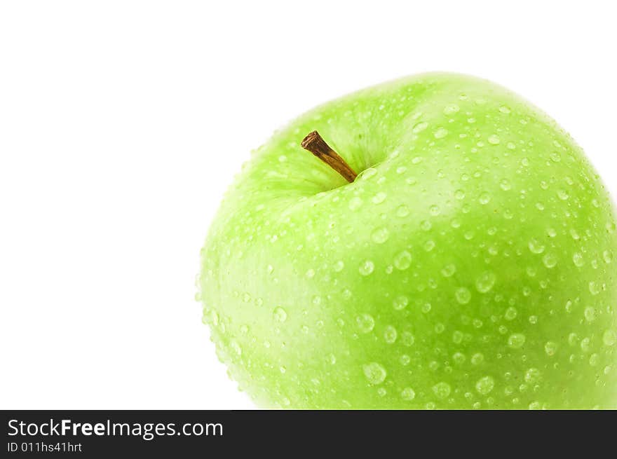 Detail of healthy green apple with fresh water drops isolated on white background. Detail of healthy green apple with fresh water drops isolated on white background