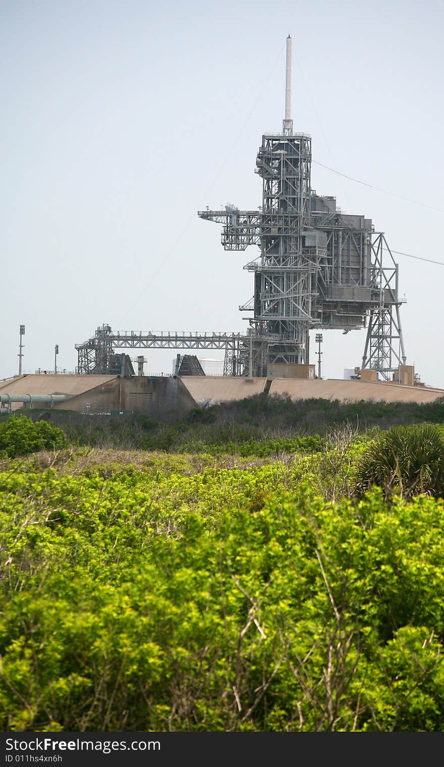 This stock photo depicts the natural flora and fauna growth leading to the Kennedy  Space Center launch complex 39 where the Space Shuttle is launched in Cape Canaveral Florida. On top of the launch complex is the 80 foot lightning mast. This stock photo depicts the natural flora and fauna growth leading to the Kennedy  Space Center launch complex 39 where the Space Shuttle is launched in Cape Canaveral Florida. On top of the launch complex is the 80 foot lightning mast.