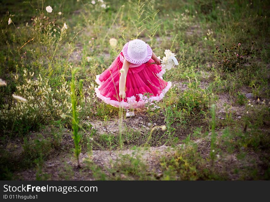 Child In A Flower Field