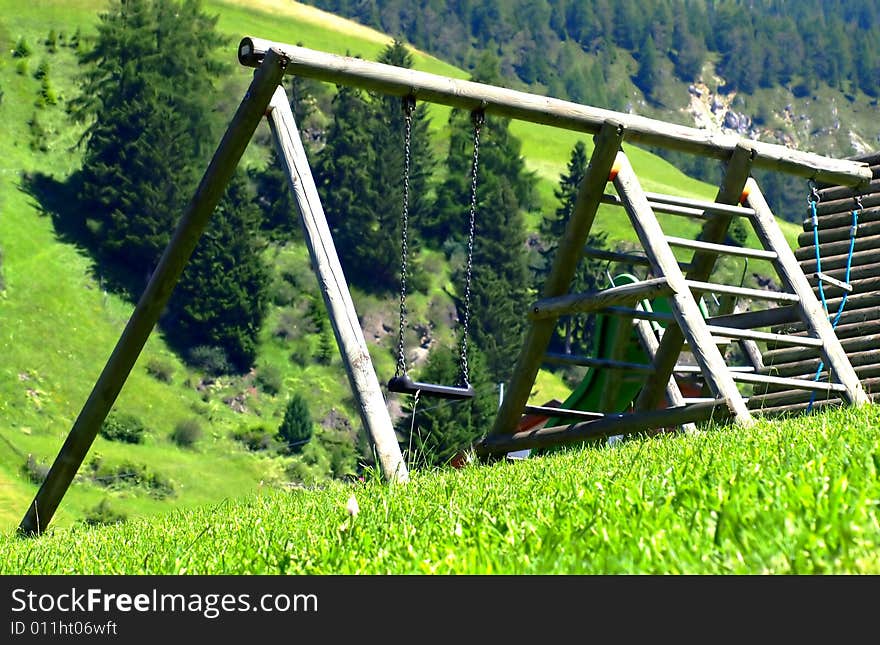 A suggestive shot of a wood's see-saw in a mountain hill