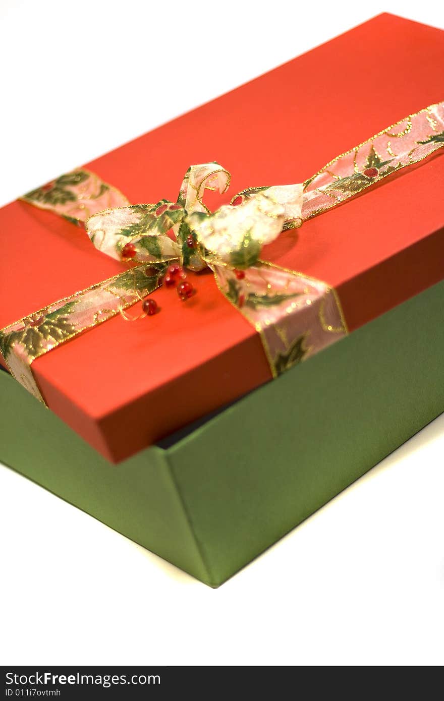 Red and green gift box with beautiful ribbon close up