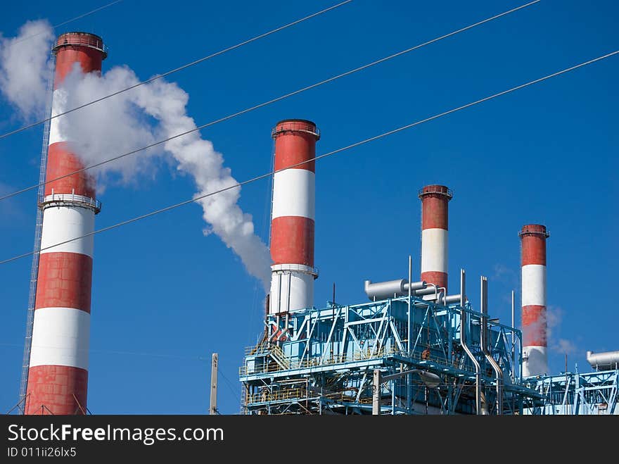 Process plants smoke stacks with smoke spewing