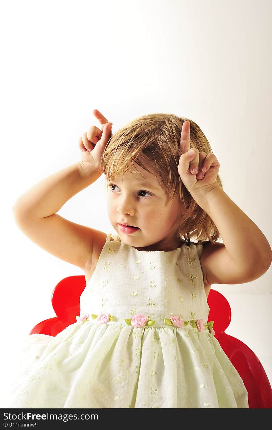 A three year old girl, photographed in the studio. A three year old girl, photographed in the studio.