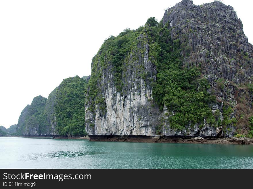 Traveling through scenic and tropical ha long bay in northern vietnam. Traveling through scenic and tropical ha long bay in northern vietnam