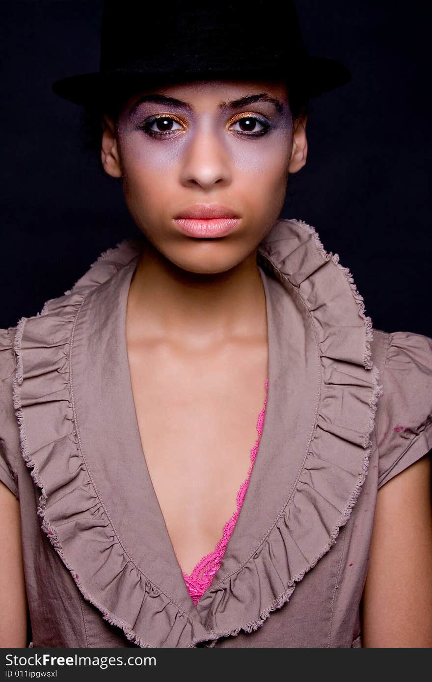 A female model in a ruffles blouse