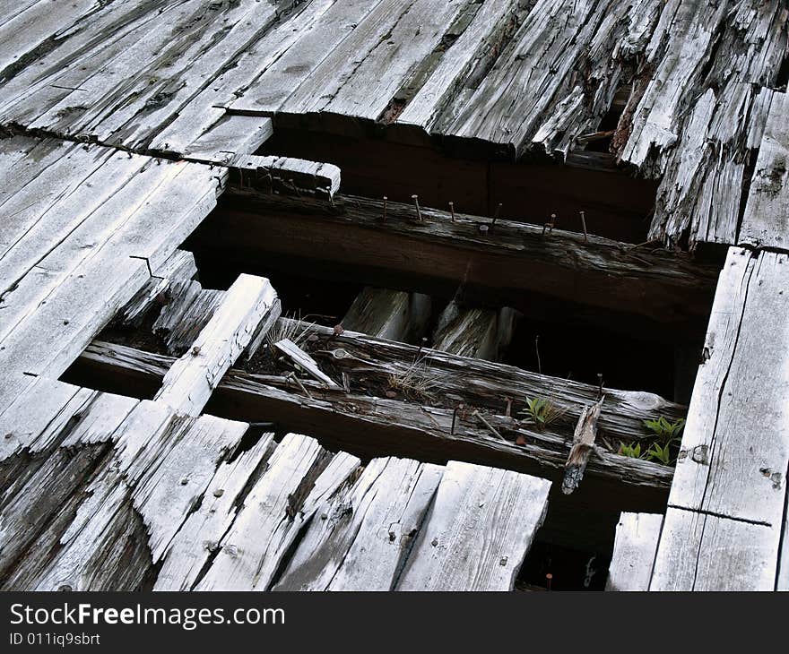 Burnt Wooden Timbers on Pier Planks over water. Burnt Wooden Timbers on Pier Planks over water