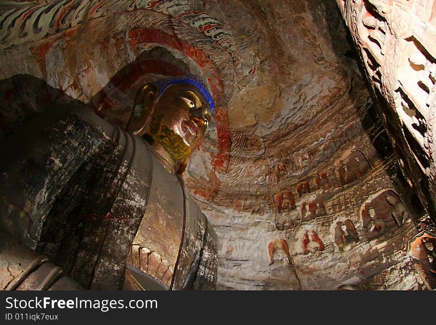 Stone carving in Yungang Grottoes, Datong, Shanxi province of China. CAVE 1(A.D.470--493) Cave 1 and cave 2 from a pair of Buddhist cave temples. In the center of cave 1 is carved a square pillar in the shape of a two-storeyed pagoda. The main statue on the bank wall is maitreya. Stone carving in Yungang Grottoes, Datong, Shanxi province of China. CAVE 1(A.D.470--493) Cave 1 and cave 2 from a pair of Buddhist cave temples. In the center of cave 1 is carved a square pillar in the shape of a two-storeyed pagoda. The main statue on the bank wall is maitreya.