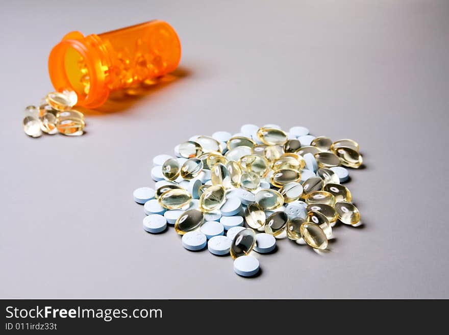 Medicine in capsules and tablets in a bottle