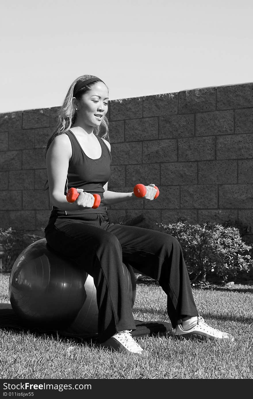 A physically fit lady doing her exercise. A physically fit lady doing her exercise