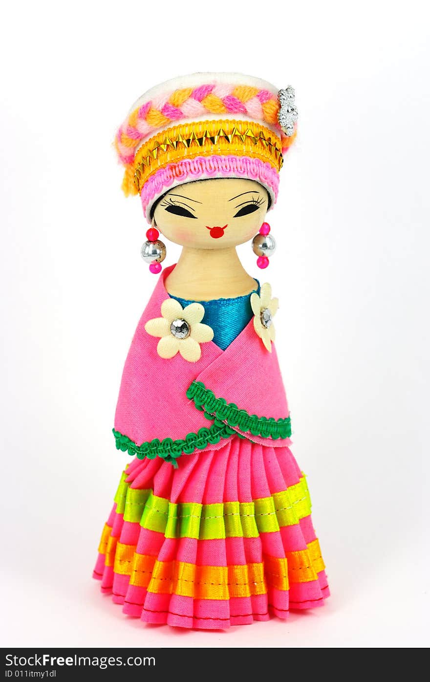 Chinese doll with ethnologic clothes and headgear on white background. Chinese doll with ethnologic clothes and headgear on white background.