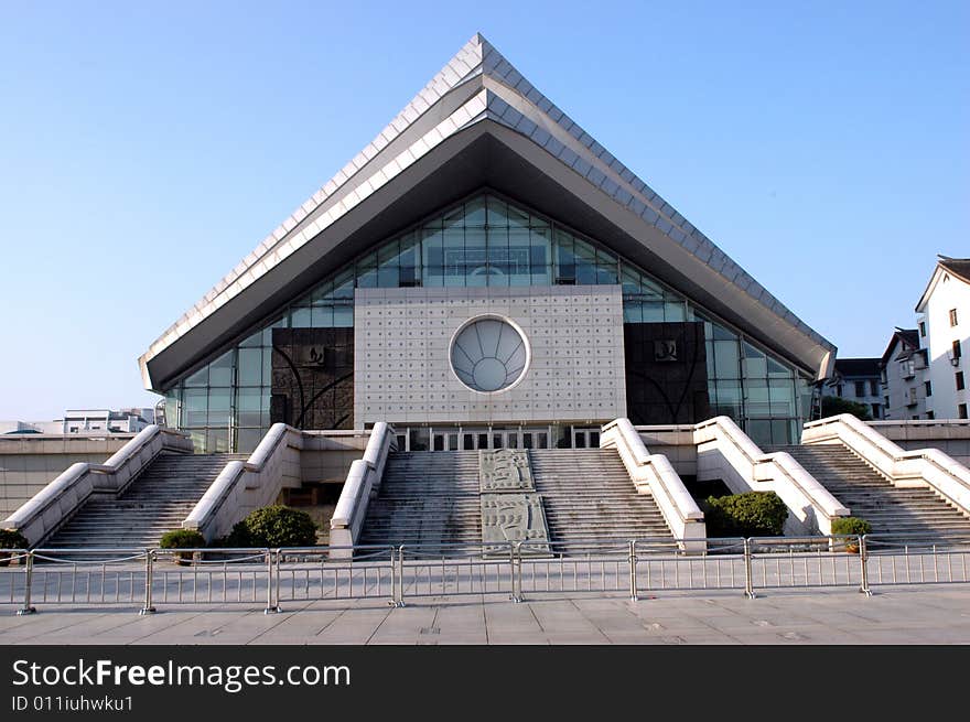 China, Zhejiang province, Shaoxing town. Special triangular construction of modern building in city center. China, Zhejiang province, Shaoxing town. Special triangular construction of modern building in city center.