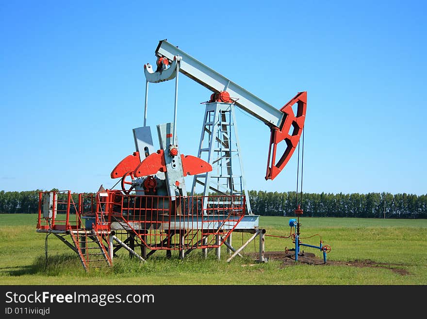 Oil Pump Jack In A Field