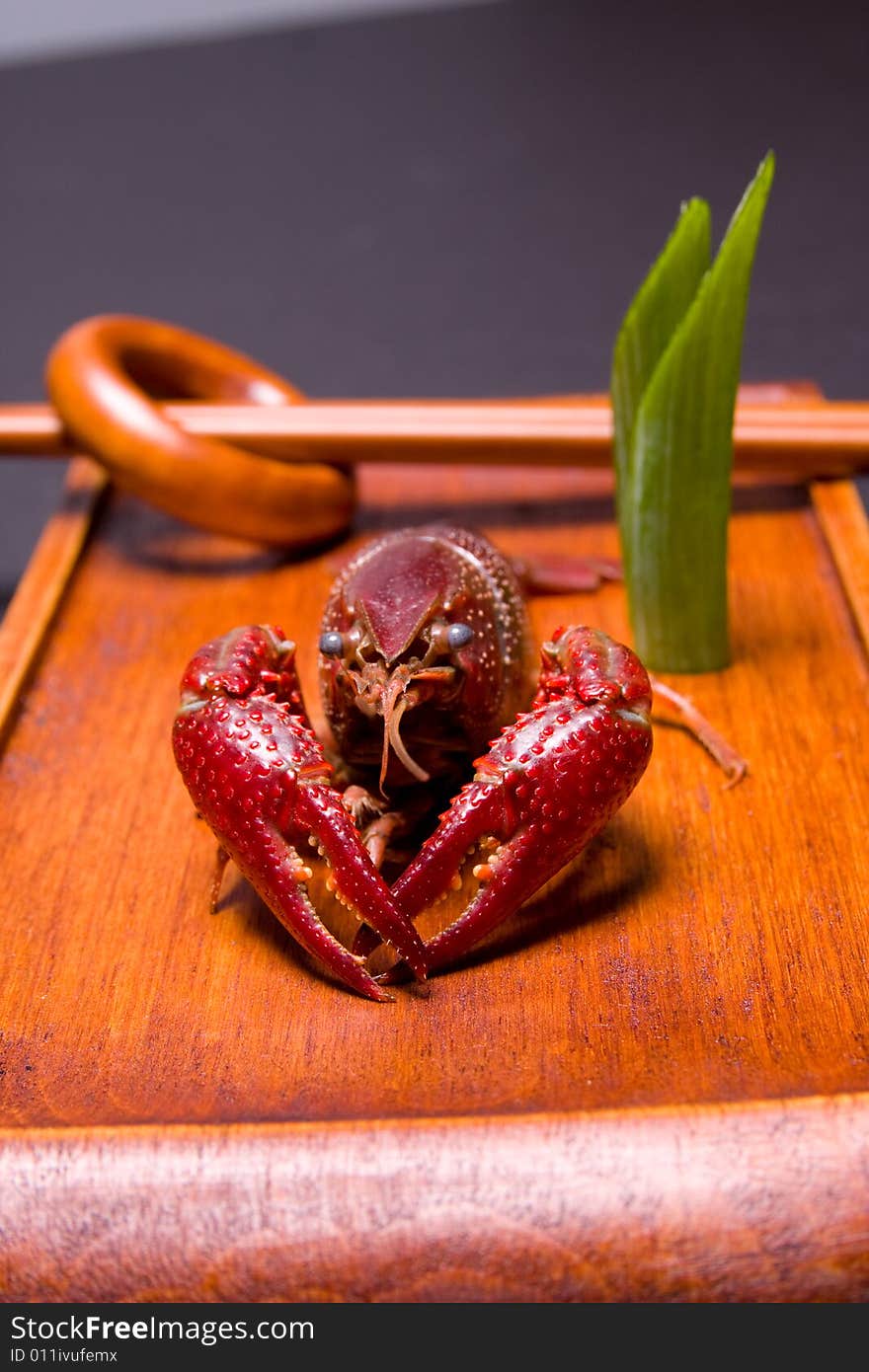 Seafood crawfish in a wooden plate. Seafood crawfish in a wooden plate.