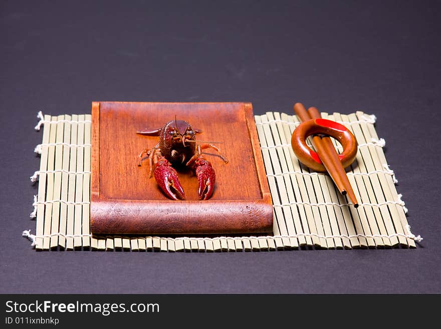 Seafood crawfish in a wooden plate. Seafood crawfish in a wooden plate.