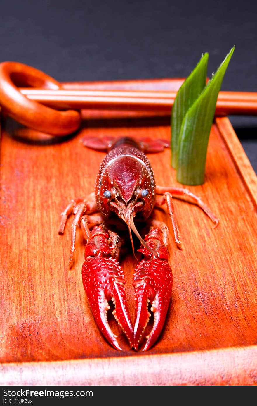 Seafood crayfish in a wooden plate.