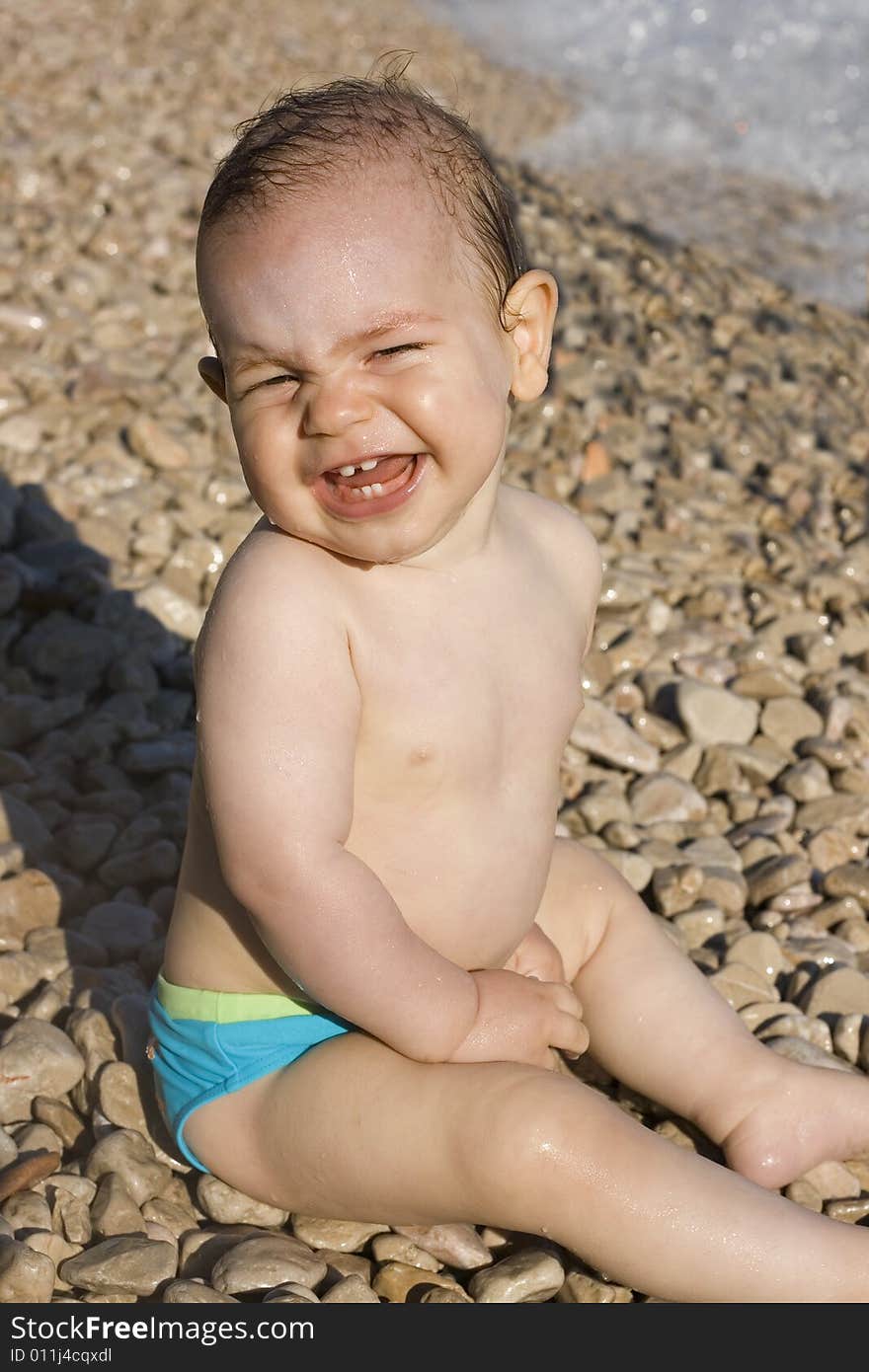 Small boy smiling on the beach. Small boy smiling on the beach