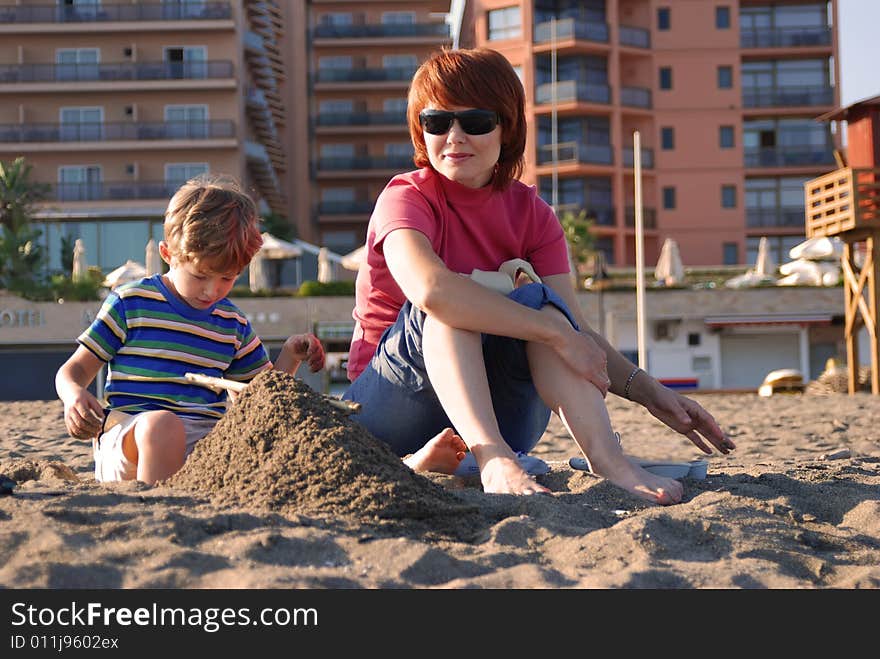 Mother and the son have a rest on a beach