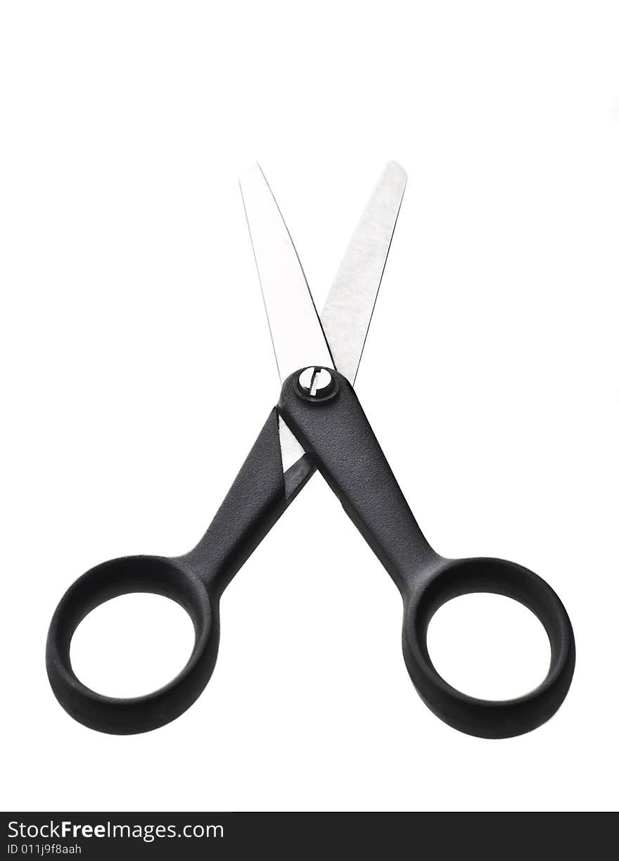 Black scissors isolated against white background