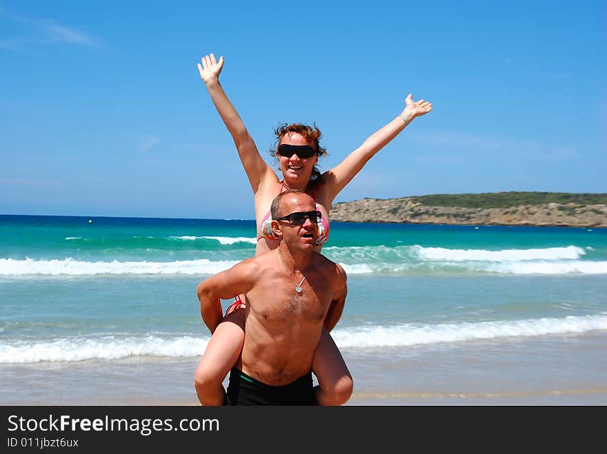 Man and  woman have a rest on coast of ocean