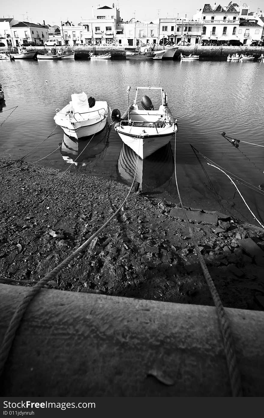 Small boats tied on Tavira sea channel. Small boats tied on Tavira sea channel