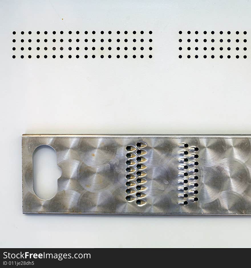 Grater on a metallic sheet