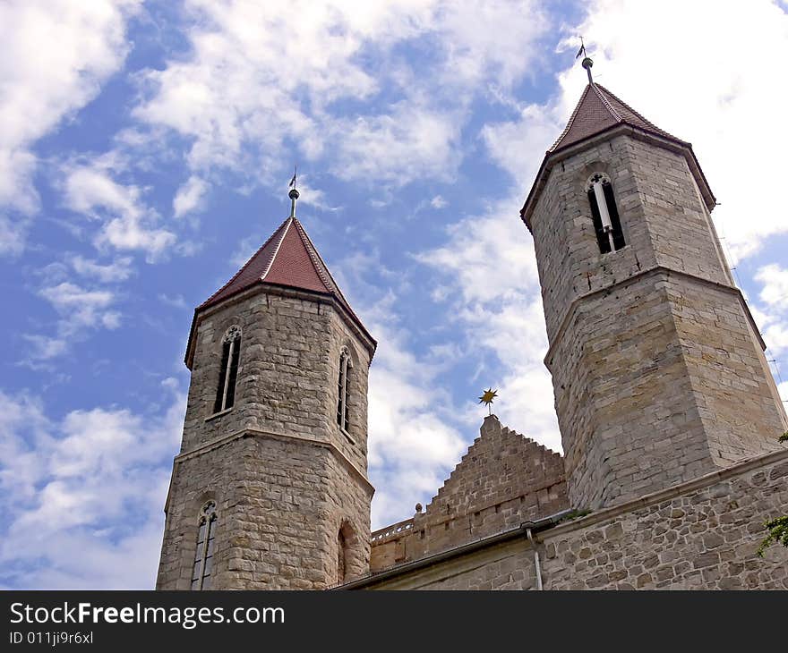 Two tower of the old historical church on background of blue sky. Two tower of the old historical church on background of blue sky