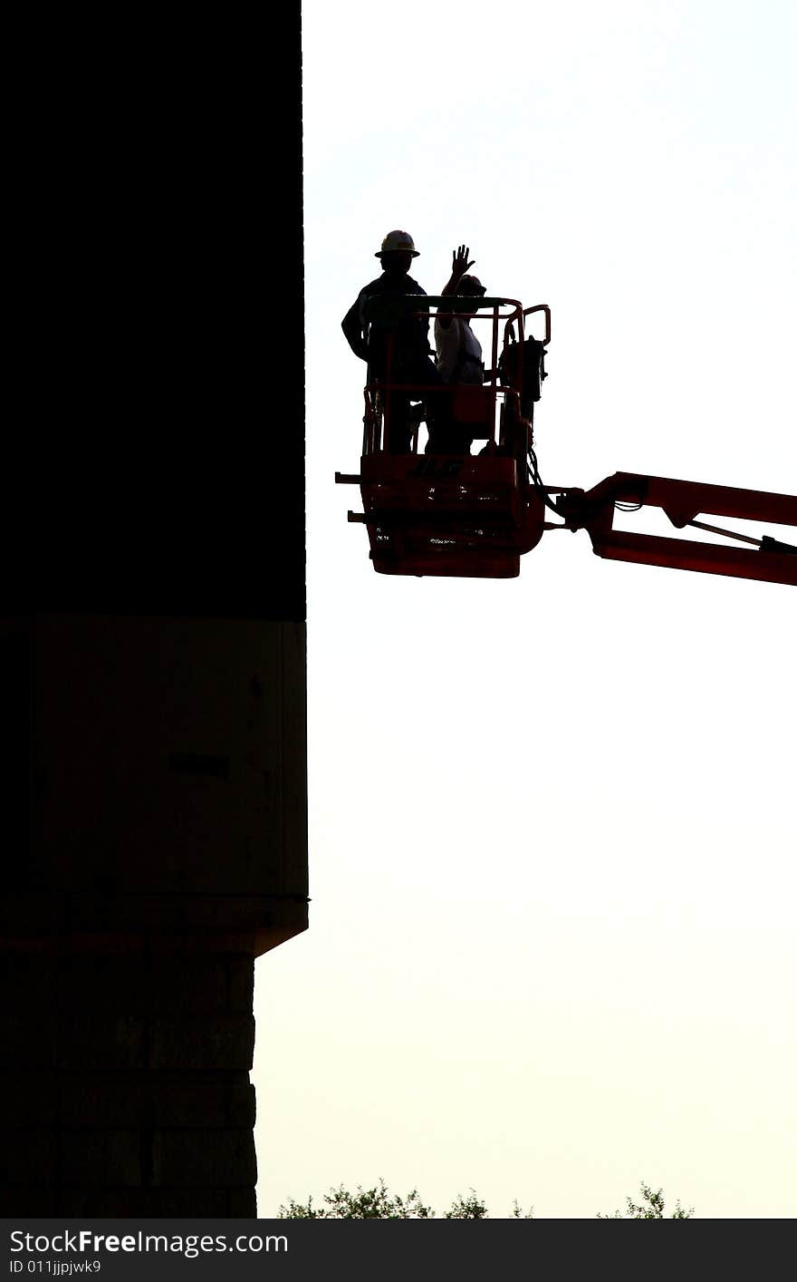 Construction workers in a lift