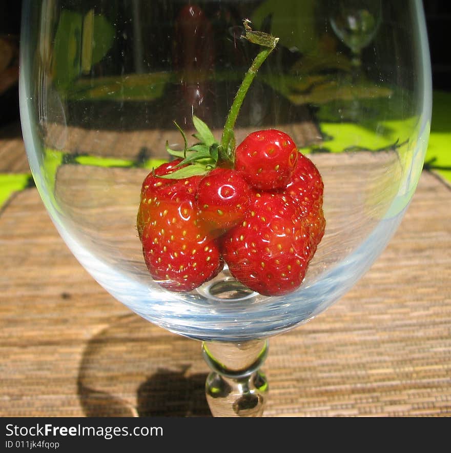 Unusual strawberry at the bottom of the glass. Unusual strawberry at the bottom of the glass