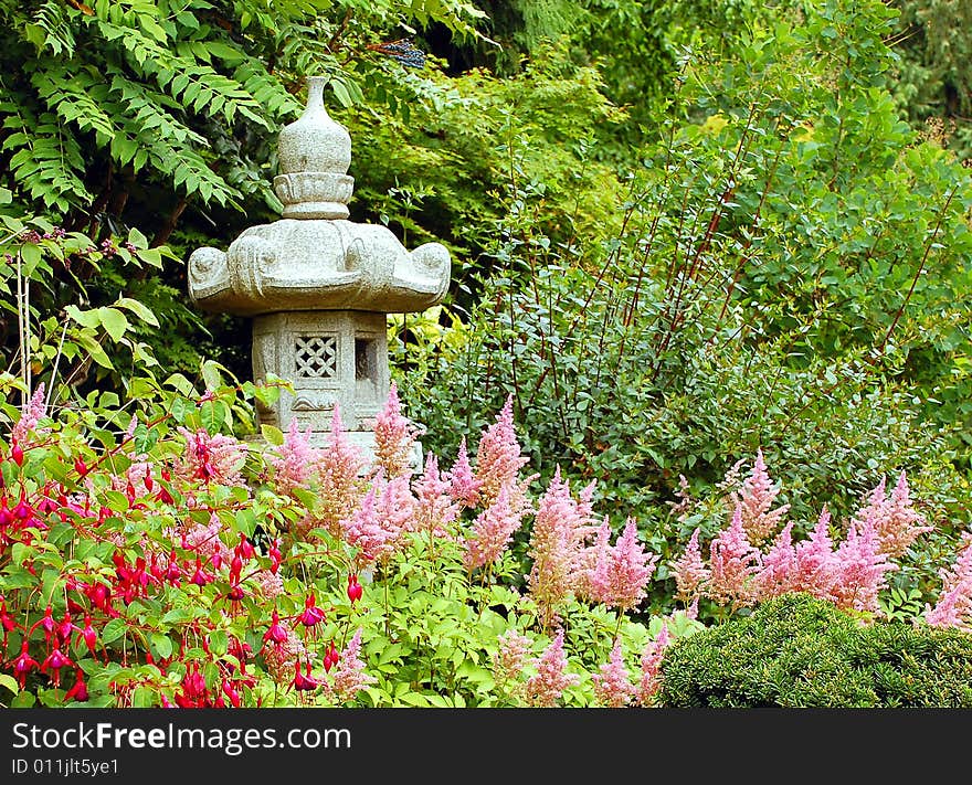 Japanese garden with ornamental statue. Japanese garden with ornamental statue