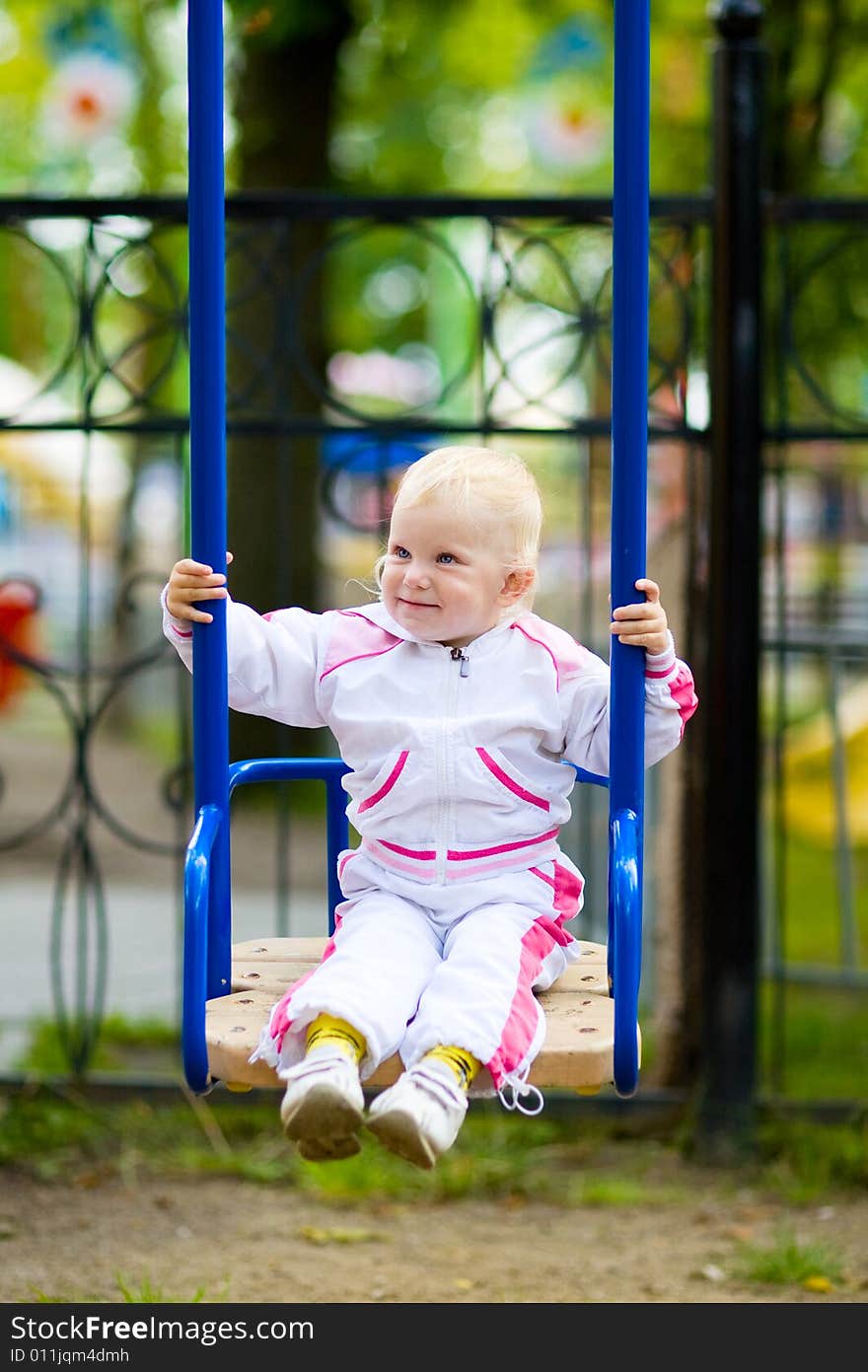 A child on the swing. A child on the swing