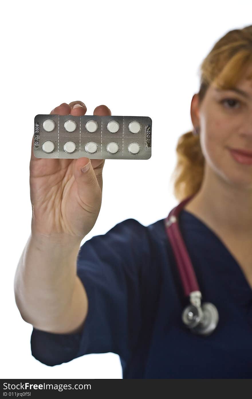 Young female doctor with stethoscope and tablets over white background. Young female doctor with stethoscope and tablets over white background