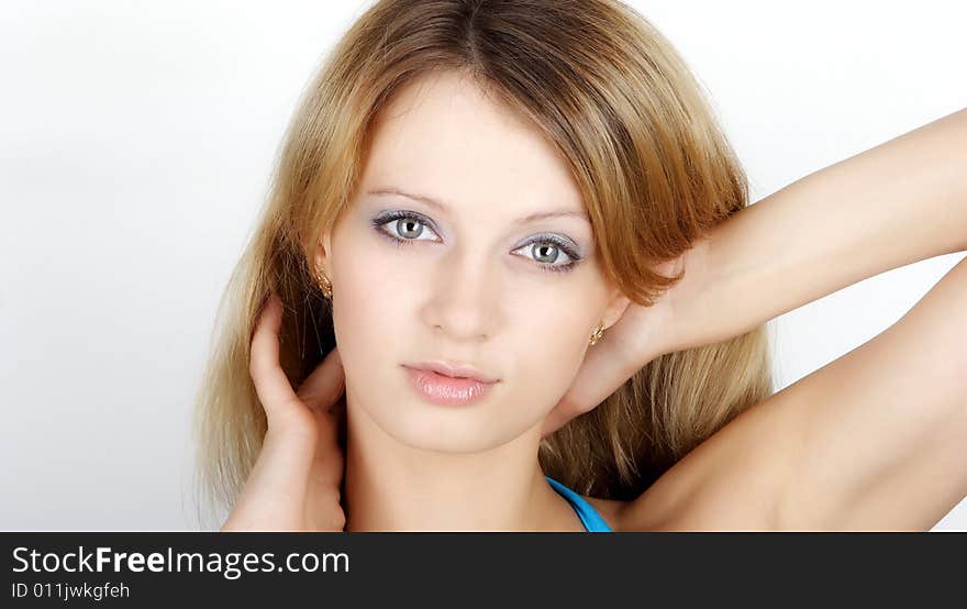 Beautiful woman. Portrait on a white background. Fashion photography.