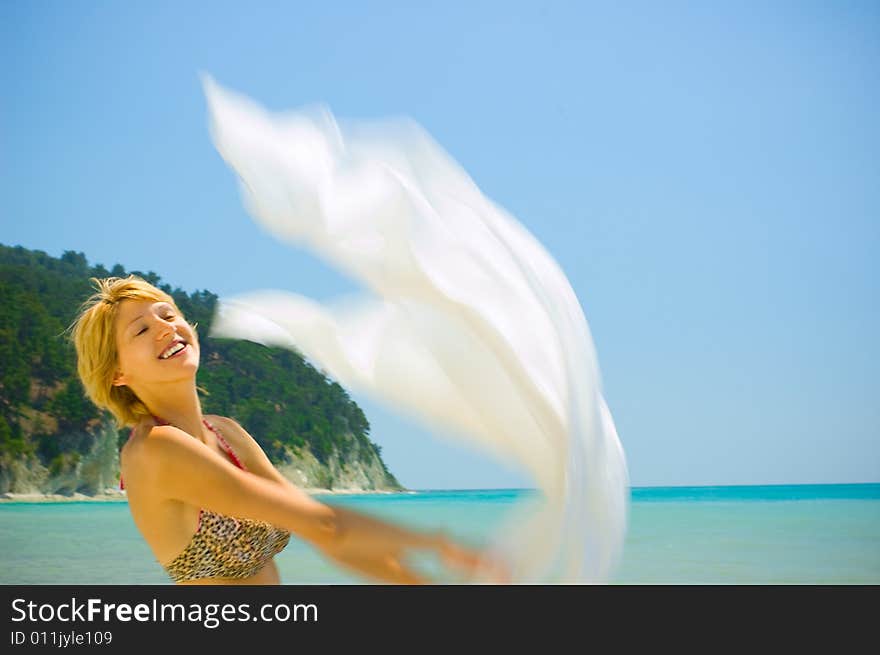 Woman Relaxing On The Beach