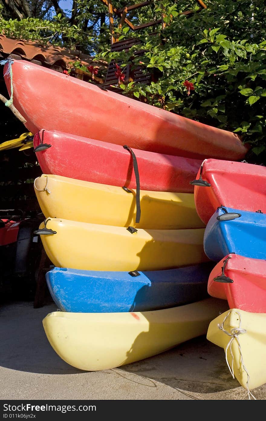 Stacks of Colorful Kayaks