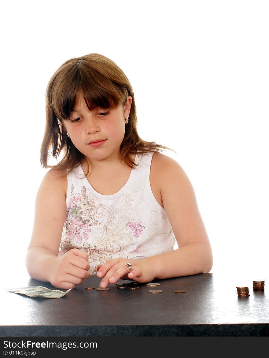 Elementary girl sad because the money she's counting isn't enough for what she wants. Elementary girl sad because the money she's counting isn't enough for what she wants.