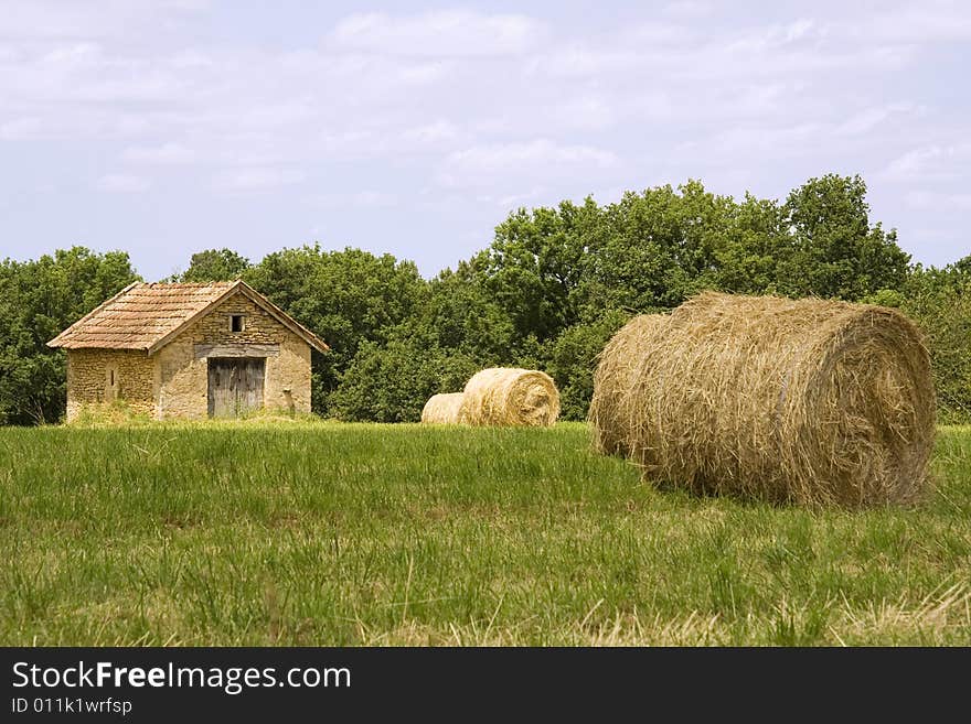 Cottage and haystacks