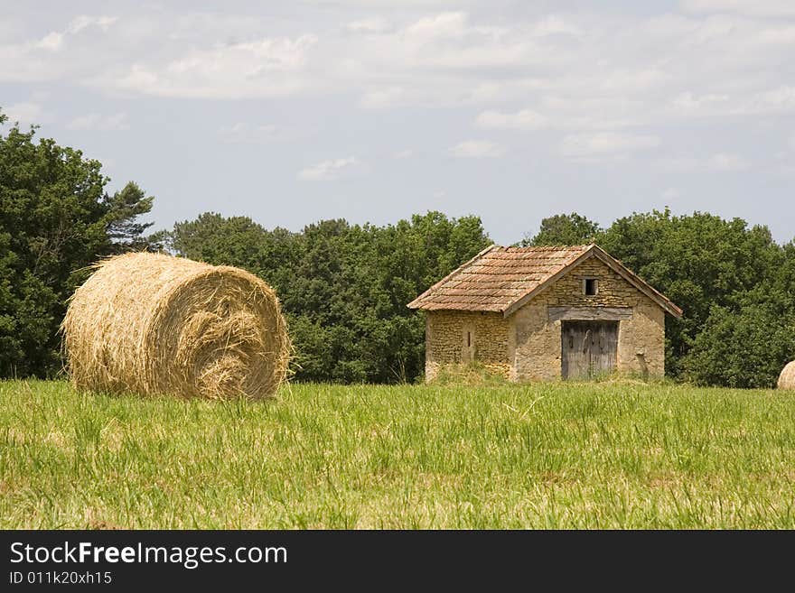 Cottage And Haystacks