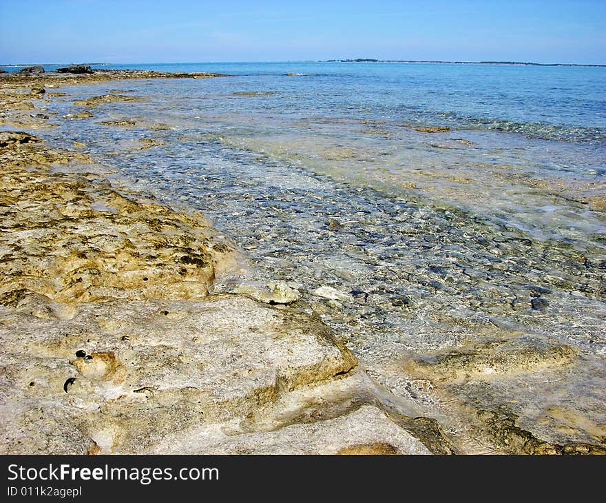 Shallow beach waters in Nassau town, The Bahamas. Shallow beach waters in Nassau town, The Bahamas.