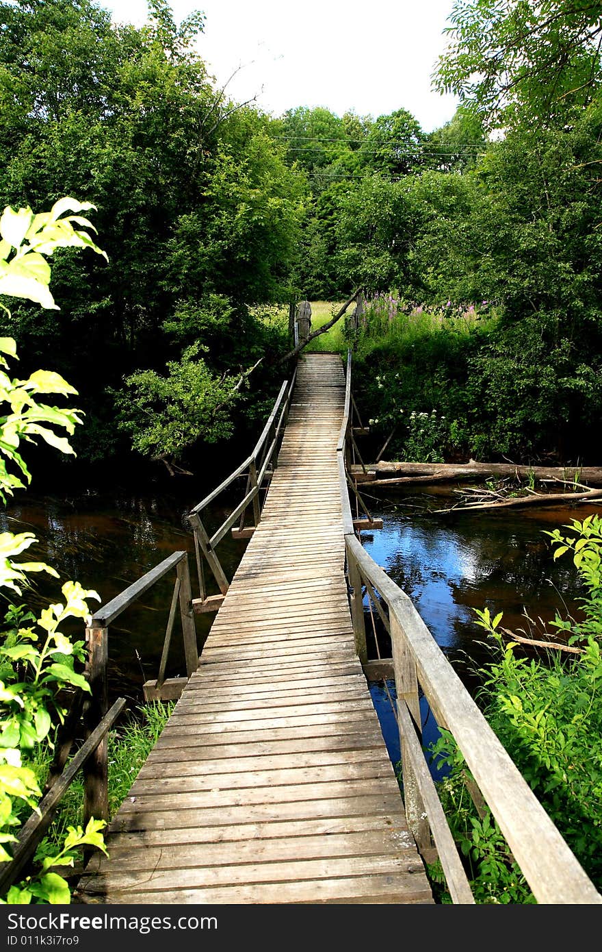 A old bridge over a river in the forest