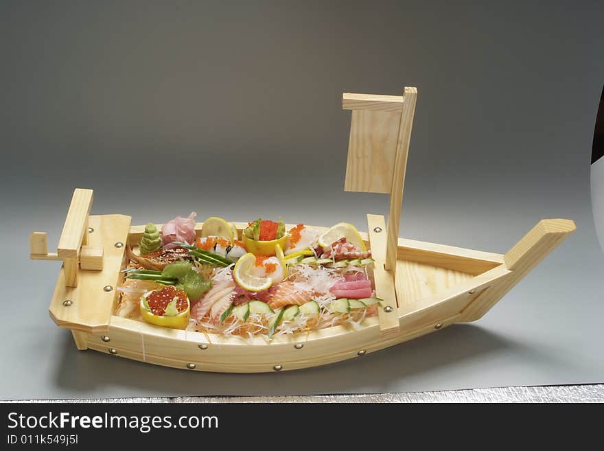 Sushi on wood plate boat