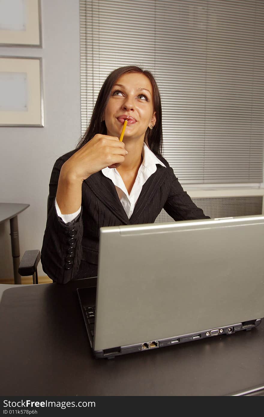 Businesswoman Sitting In Office