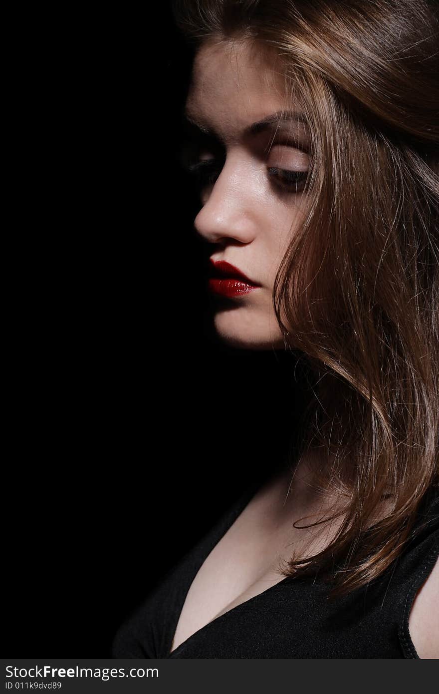 Beauty Girl with Red Lips. Isolated on Black Background. Beauty Girl with Red Lips. Isolated on Black Background