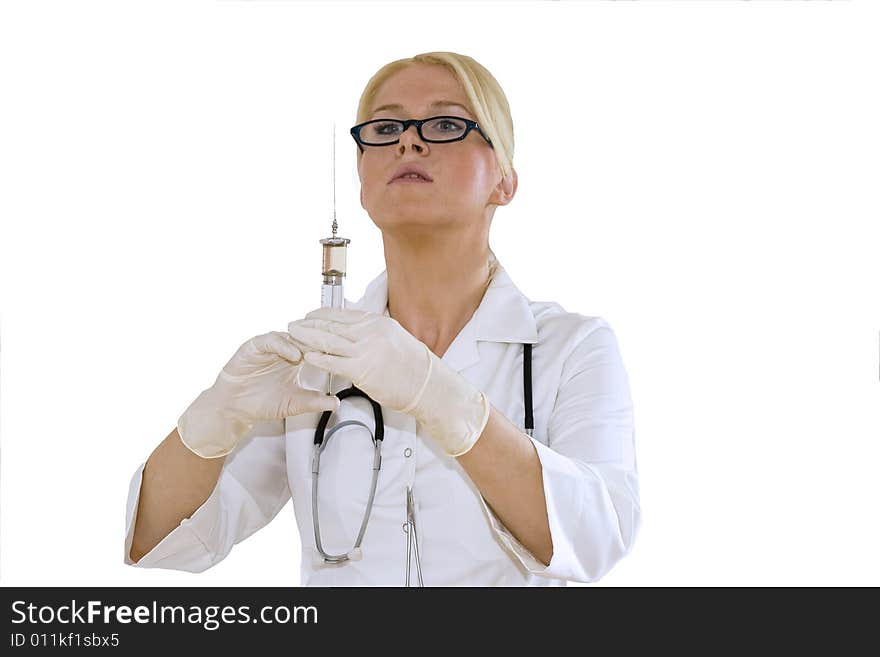 A young female doctor/nurse prepares to make an injection isolated on white background