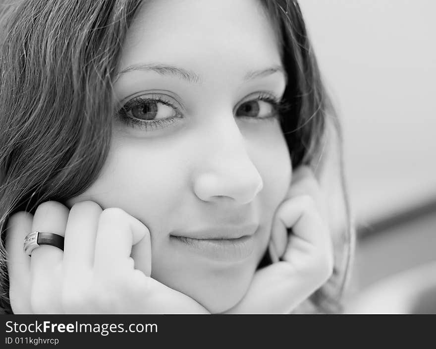 Face of smiling pretty brunette. Black & white