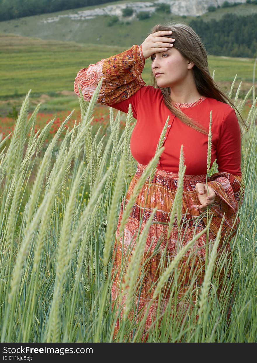 Thoughtful girl with hand near head