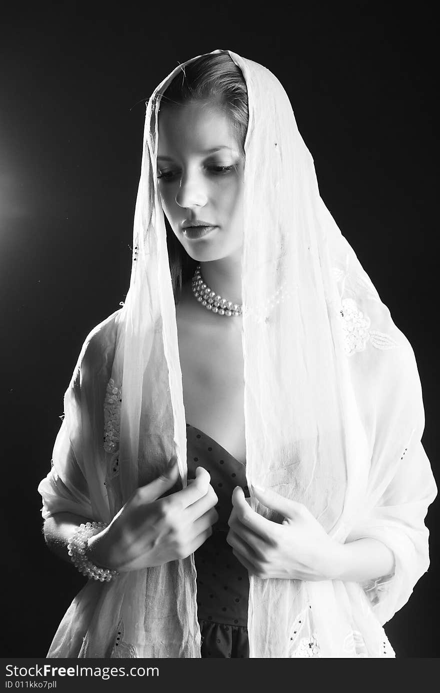 Beauty young woman in dress  at black background